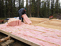 Insulating material is laid into the frame.